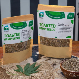 Two packs of Toasted hemp seeds Packed by parvati valley hemp company displayed with a hemp leaf
