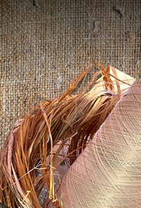 Hemp fibre is displayed with processed fibre inside a jute bag